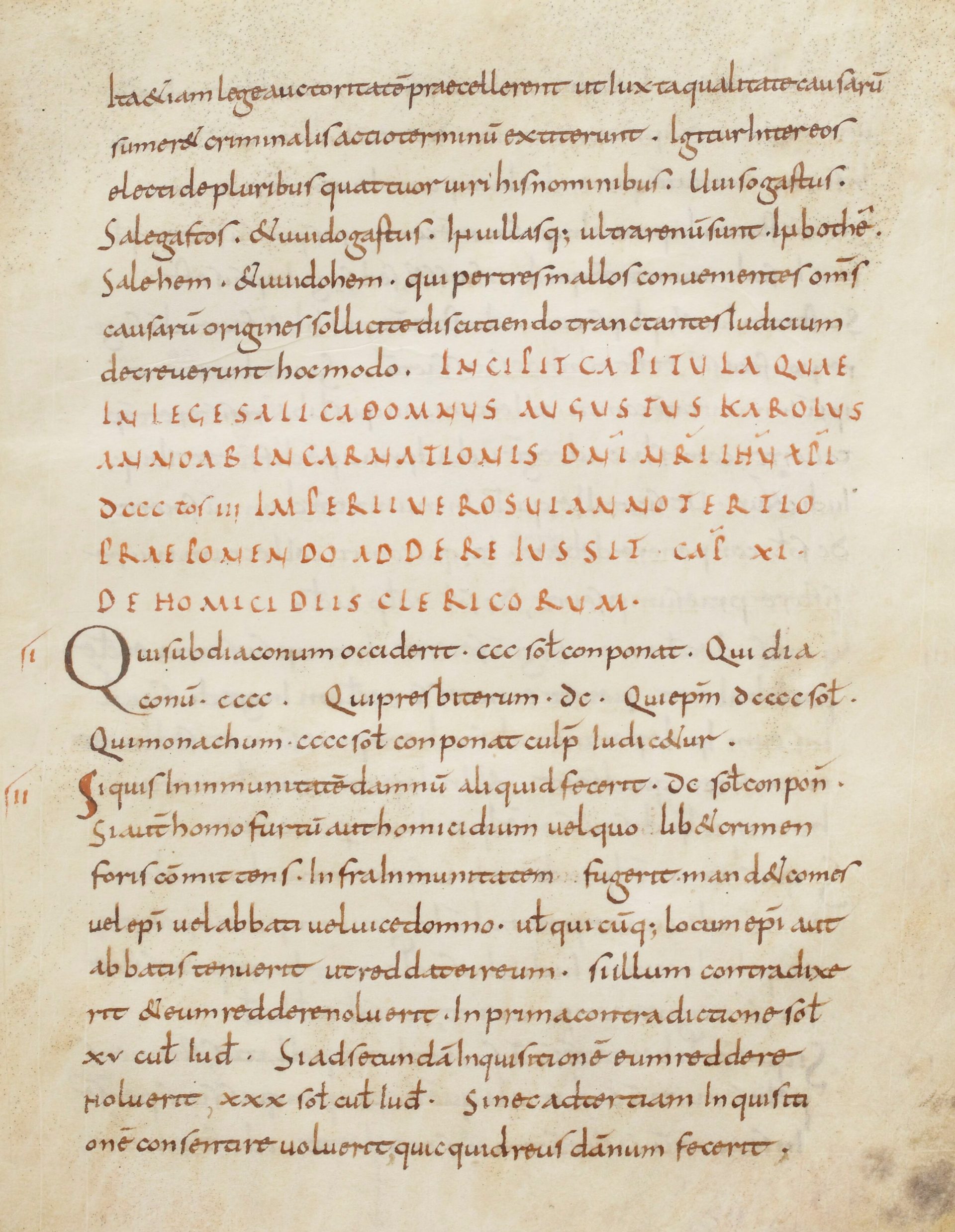 page of a medieval manuscript with legal writing and rubric in red