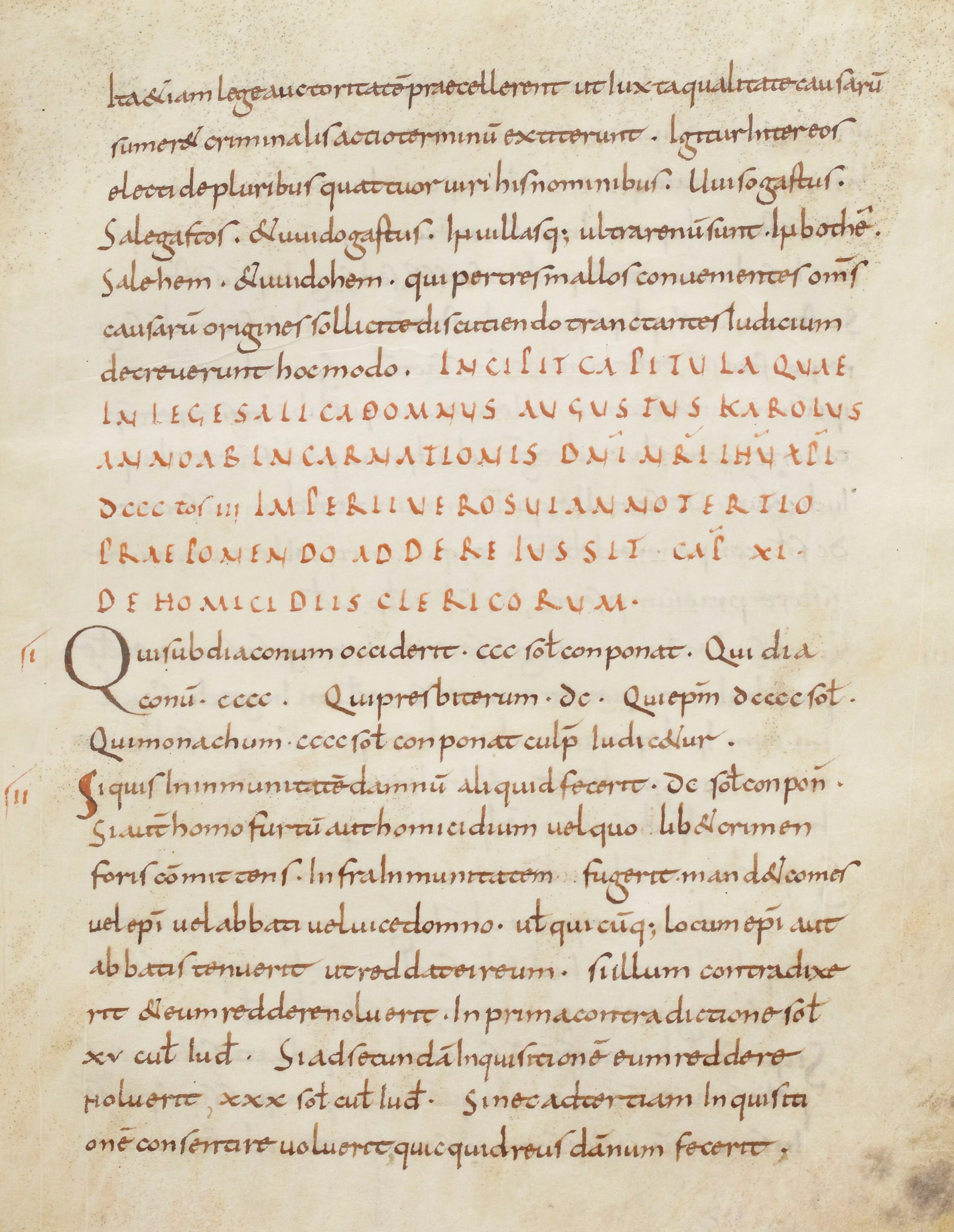 page of a medieval manuscript with legal writing and rubric in red