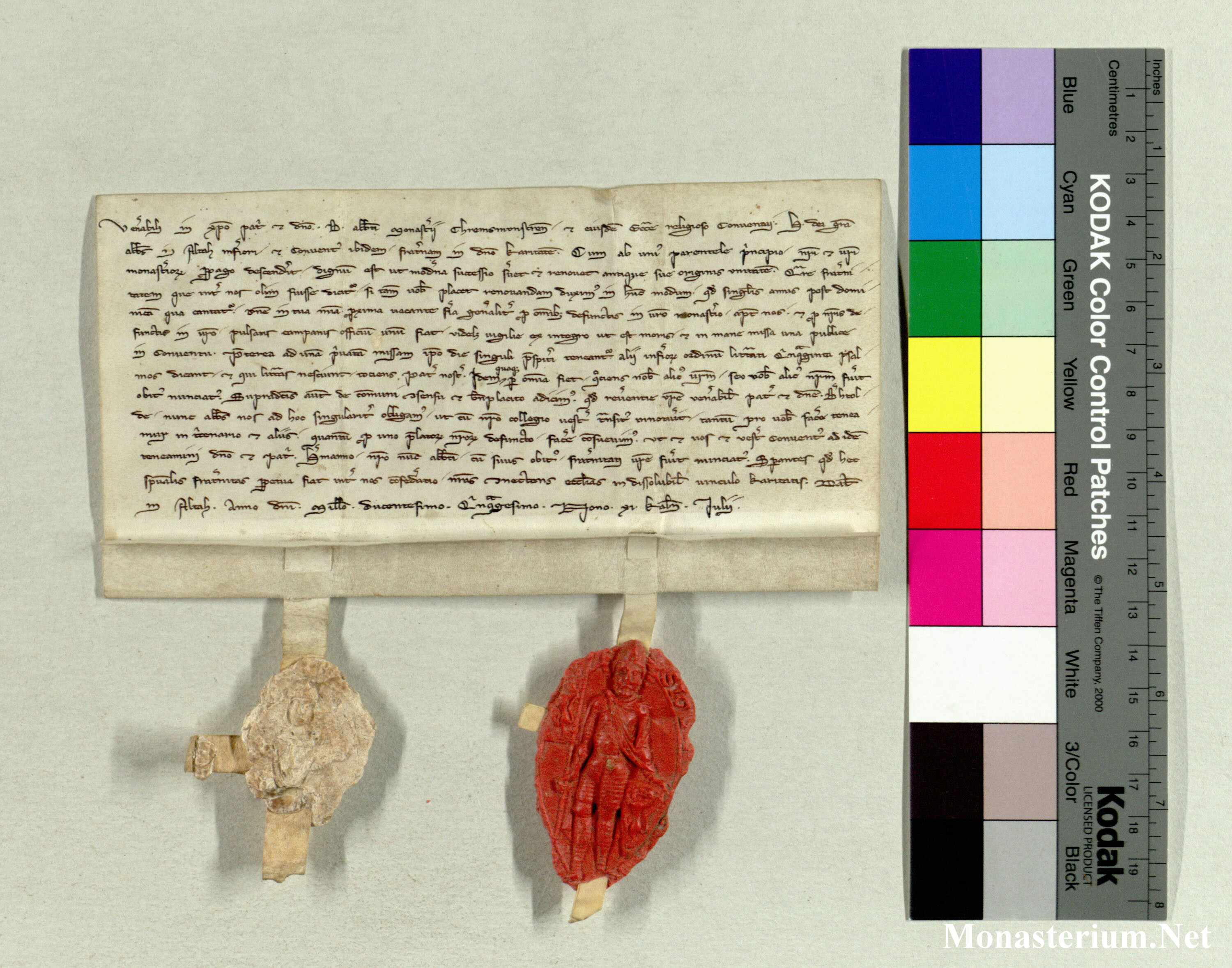 medieval charter with a red seal, photographed against a neutral background and next to a colour strip as a control patch